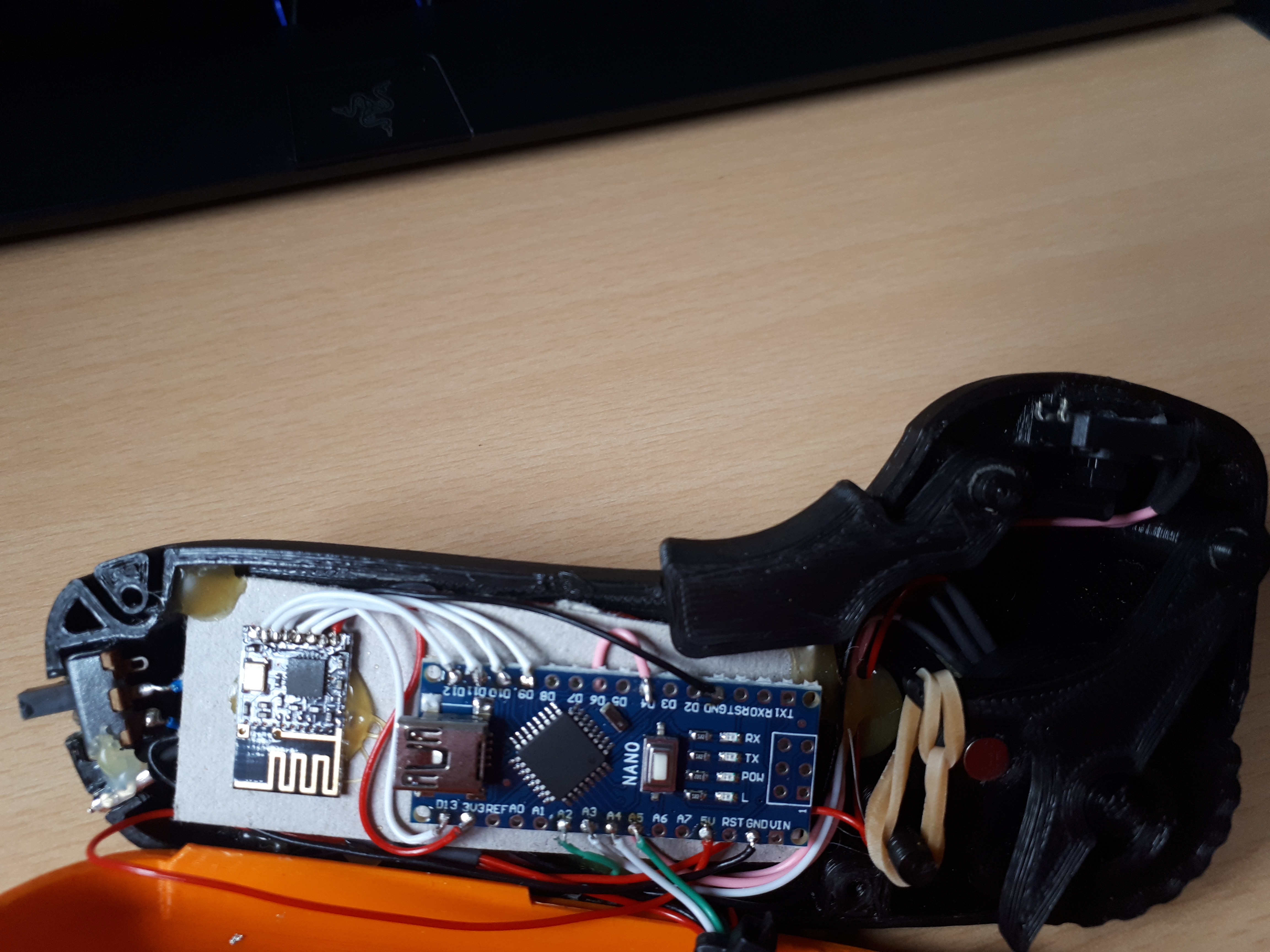 The inside of the remote showing the controller and throttle assembly