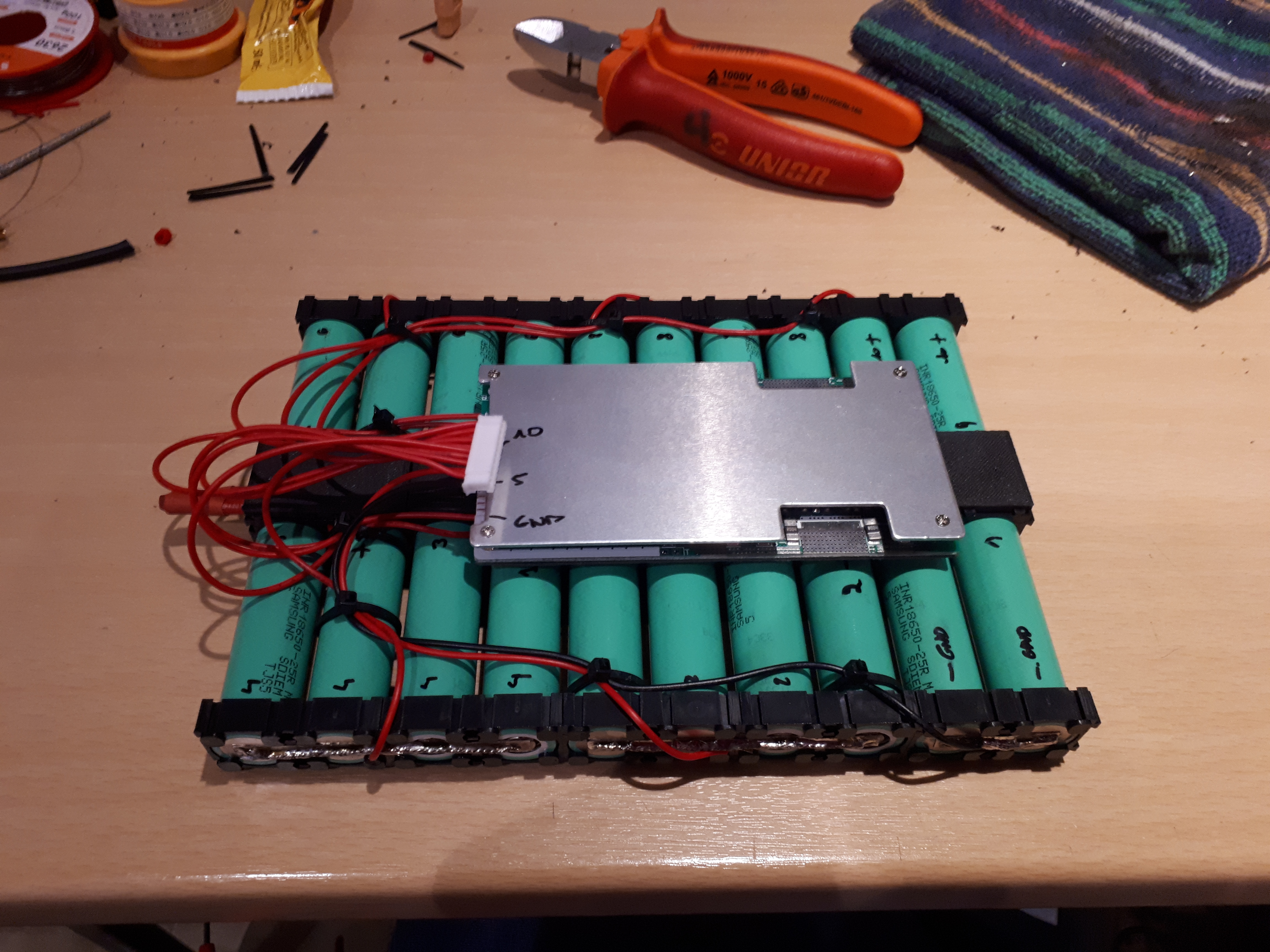 The pack assembled with the BMS on top