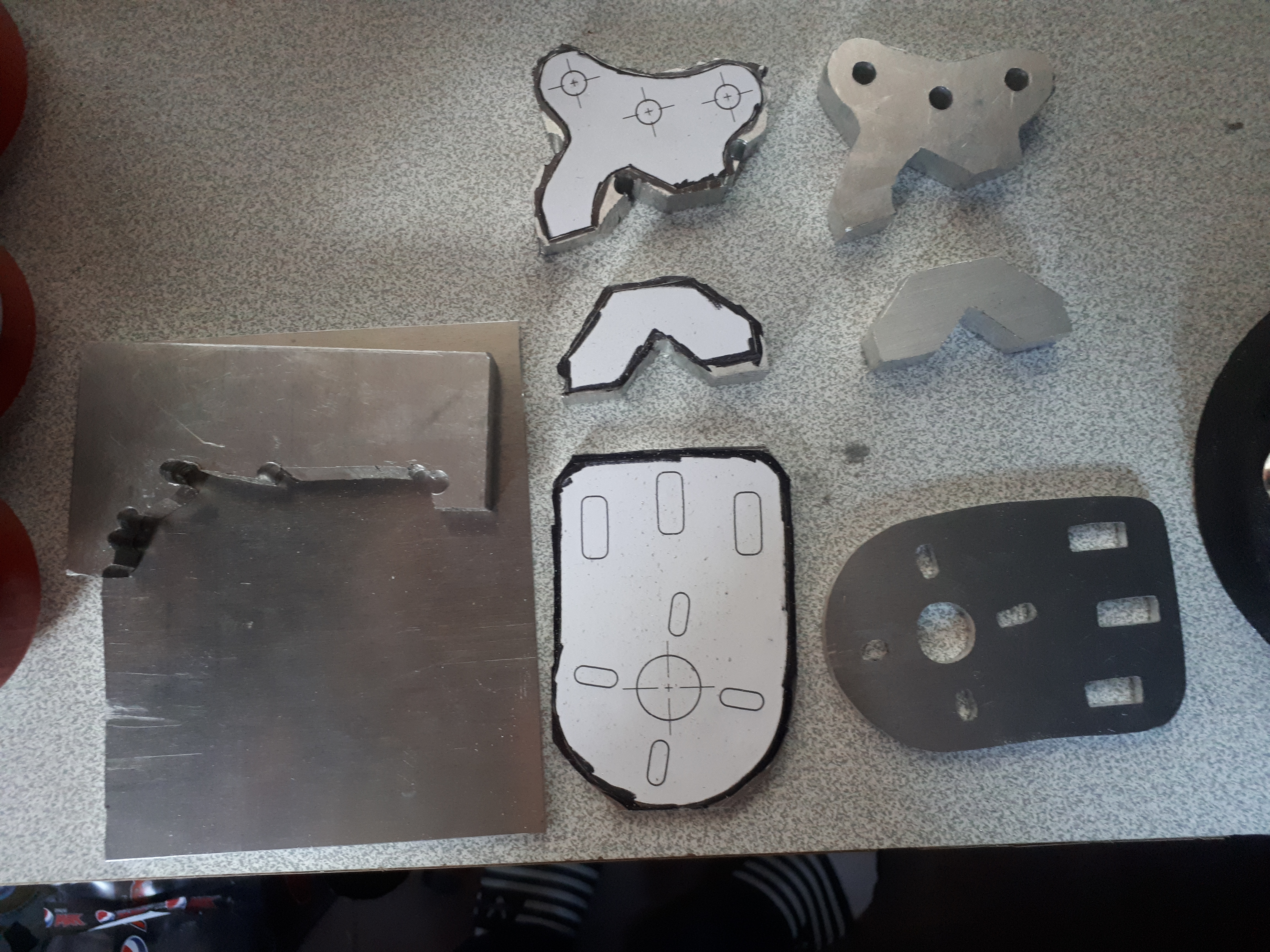 The new mounts being cut from thick aluminum