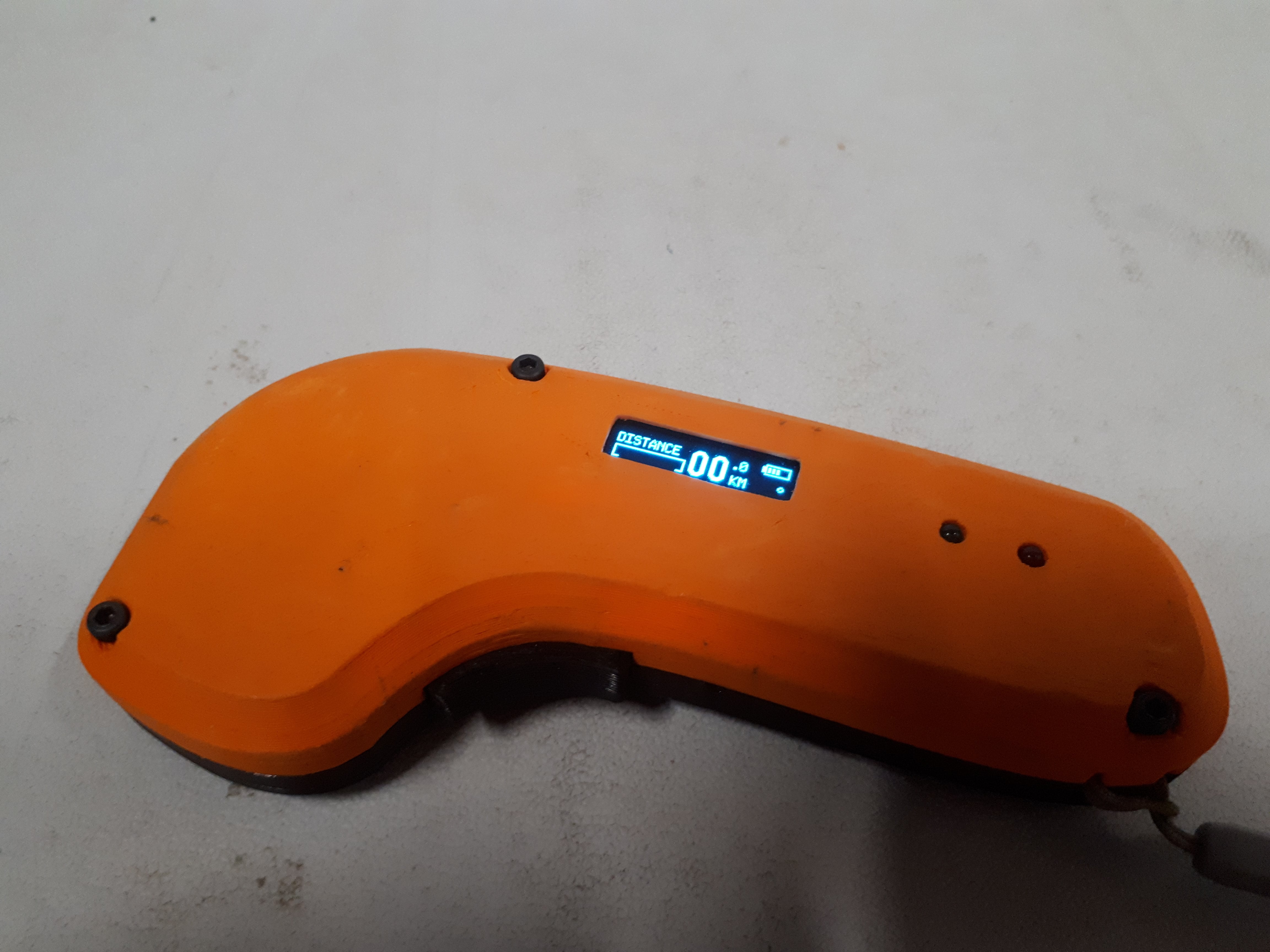 Finished remote showing battery voltage on its OLED screen